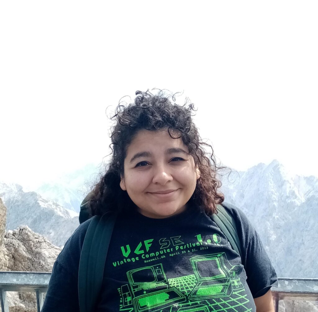 Dafne Sanchez smiles at the camera in front of the Zugspitze, Germany's highest mountain.