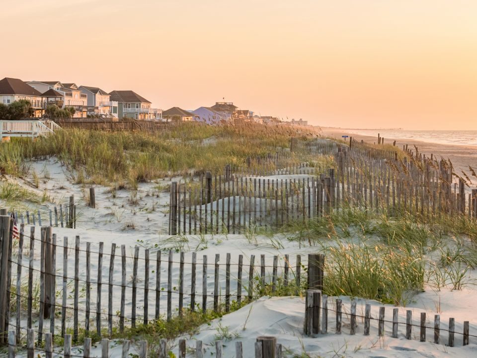 Emerald Isle sand dunes and ocean waves in the morning.