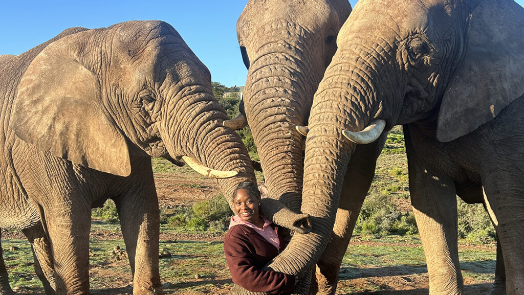 Carla Smalls poses with elephants